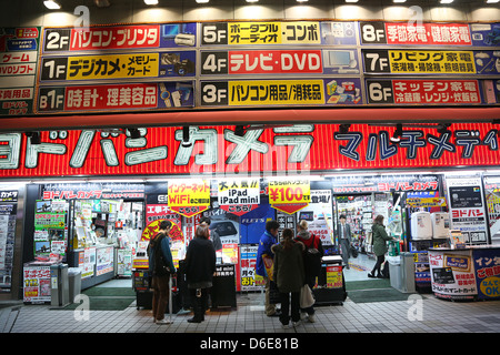 Night street scene of electronics and white good shop in Shinjuku, Tokyo, Japan Stock Photo