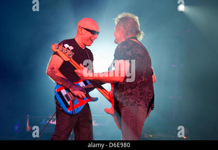 The members of the US-band Chickenfoot  Joe Satriani (L) and Sammy Hagar perform on stage during a concert tour in Duesseldorf, Germany, 19 January 2012. Four major musicians of rock music have come together to form the line-up of the unusual music project Chickenfoot. The line-up consists of Sammy Hagar, former singer of the US-band Van Halen, Michael Anthony, former Van Halen bas Stock Photo