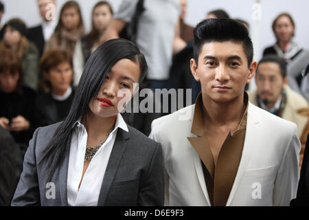 Chinese artist Yi Zhou (L) and Taiwanese singer and actor Nicky Wu attend the presentation of Dior Homme fall/winter 2012/2013 collection during the Paris Men's fashion week, in Paris, France, 21 January 2012. The Paris Men's fashion week runs until 22 January 2012. Photo: Hendrik Ballhausen Stock Photo