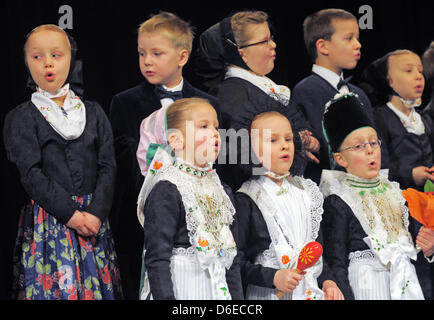 Boys and girls of a nursery school celebrate the Sorbian tradition of the Marriage of the Birds in Crostwitz, Germany, 25 January 2012. Dressed in the traditional costumes of a marriage procession the children sang 'A bird wanted to marry' in Sorbian. The old Sorbian custom 'Marriage of the Birds' celebrates the soon to come end of winter. Photo: MATTHIAS HIEKEL Stock Photo