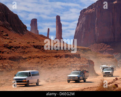 The Monument Valley Navajo Tribal Park one of the most famous parks next to the Grand is seen in Arizona, USA, 31 December 2011. The Monument Valley is a region of the Colorado Plateau characterized by a cluster of vast sandstone buttes, the largest reaching 1,000 ft (300 m) above the valley floor. The valley's vivid red color comes from iron oxide exposed in the weathered siltston Stock Photo