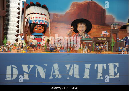 A fair visitor tests pawns of Playmobil for table football Stock Photo -  Alamy