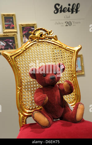 Teddy bear Louis, Steiff Club Edition 2012, sits in a golden chair at the  stand of the stuffed animal maker at the 63rd International Toy Fair in  Nuremberg, Germany, 01 February 2012.