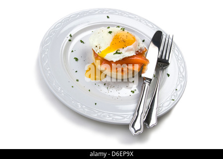 Soft poached egg on muffin with smoked salmon Stock Photo