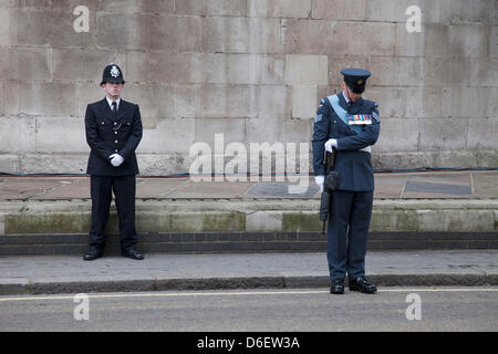 London , UK. 17th April 2013. The funeral of former Prime Minister Baroness Margaret Thatcher. Metropolitan police on duty outside St Clement Danes Church prior to the funeral. Security was high with various layer of the armed forces and emergency services all on hand. Credit: Michael Kemp/Alamy Live News Stock Photo