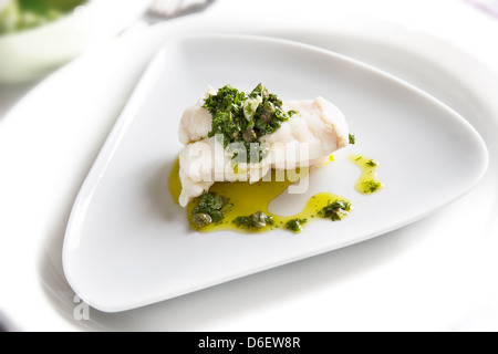 Fillet of Turbot served with a traditional salsa verde. Stock Photo