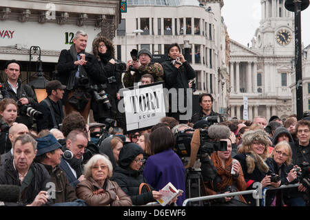 London, England UK 17/04/2013. The press pack mingles with protesters waiting for the gun carriage bearing Margaret Thatcher's coffin on Ludgate Circus.  Protesters turned their back as the coffin approached and chanted 'waste of money' at the military procession. Stock Photo