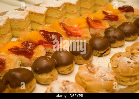 mini cakes and pastries on the dessert buffet of a cruise ship Stock Photo