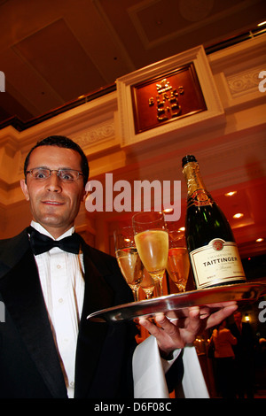 Waiter serving champagne at a jewelry launch event in Vancouver, Canada Stock Photo