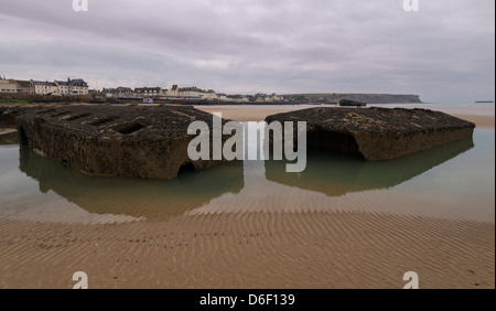 Ruins of the Mulberry Harbour,  temporary artificial port,  beach of  Arromanches-les-Bains, Landing beach, Calvados, Normandy, France. WWII. Stock Photo