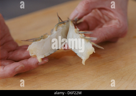 Butterflying Raw Prawns Stock Photo