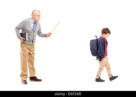 Full length portrait of an angry teacher shouting at a little schoolboy, isolated on white background Stock Photo