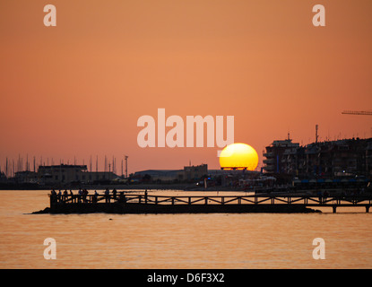 the sun sets behind the harbor of Ostia, Rome Stock Photo