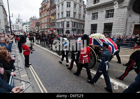 London, UK. 17th April, 2013. The coffin of former British Prime Minister, Margaret Thatcher is drawn along Fleet St on a First World War gun carriage towards her funeral at St Paul's Cathedral, London.  Photography by Jason Bye   /Alamy Live News Stock Photo