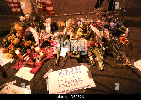 Boston, Massachusetts, USA. 16th April, 2013. A memorial lays just blocks from the explosion scene on Boylston Street in Boston. People left flowers and messages including' Boston Will Overcome' for the victims and wounded in the bombing. (Credit Image: Credit:  Ken Crane/ZUMAPRESS.com/Alamy Live News) Stock Photo