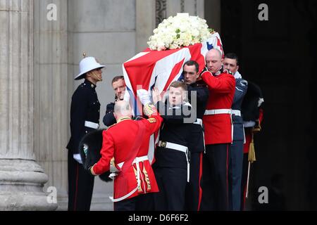 London, UK. 17th April, 2013. Margaret Thatcher's coffin leaves St Paul's Cathedral in Central London followed by her son Mark and his wife 17th April 2013. Dignitaries from around the world joined Queen Elizabeth II and Prince Philip, Duke of Edinburgh as the United Kingdom pays tribute to former Prime Minister Thatcher Baroness Thatcher during a Ceremonial funeral with military honours at St Paul's Cathedral. Lady Thatcher, who died last week, was the first British female Prime Minister and served from 1979 to 1990. Stock Photo