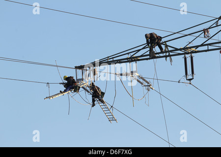 Rendsburg, Germany, workers replace insulators on high voltage pylons Stock Photo