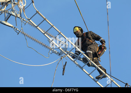 Rendsburg, Germany, workers exchanged insulators on high voltage pylons Stock Photo