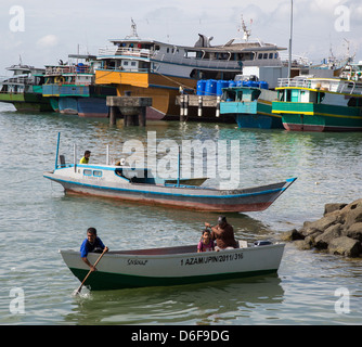 Boats big and small in the busy harbour of Sandakan in Sabah Malaysian Borneo Stock Photo