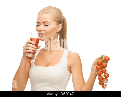 woman drinking tomato juice Stock Photo