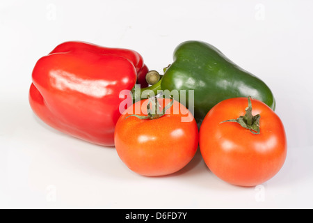 Two peppers and tomatos isolated on white background. Stock Photo