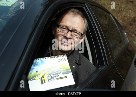 Staircase constrcution company owner Wolfgang Becker shows a flyer for the campaign 'Connection Future' from his car in Neitersen, Germany, 16 April 2013. The region Altenkirchen has been fighting for a better connection to the Autobahn A3, for bypasses and the expansion of the highways 8 and 414 for a quarter of a century. Photo: THOMAS FREY Stock Photo