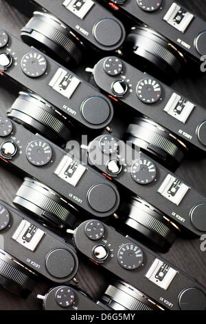 (dpa-file) - A file picture dated 26 August 2011 shows newly produced cameras of the model Leica X1 at the headquarters of Leica Camera in Burgsolms, Germany. The company Leica AG presents its financial figures on 10 February 2012. Photo: Frank Rumpenhorst Stock Photo