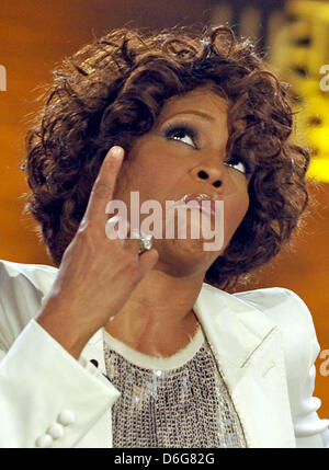 (dpa file) - A file picture dated 03 October 2009 shows US singer Whitney Houston at the german tv show 'Wanna bet that...?' at Rothaus-Arena in Freiburg, Germany. Houston died at the age of 48 in a hotel in Los Angeles in the afternoon of 11 February 2012 local time. The cause of death is not yet disclosed. Photo: Joerg Koch Stock Photo