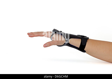 Carpal Tunnel Syndrome Brace. Woman's hand isolated on white. Stock Photo