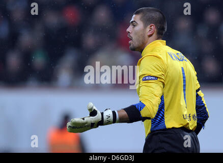 Barcelona's goalkeeper Victor Valdes reacts during the Champions League round of sixteen first leg soccer match between Bayer Leverkusen and FC Barcelona at the BayArena in Leverkusen, Germany, 14 February 2012. Photo: Federico Gambarini dpa/lnw Stock Photo