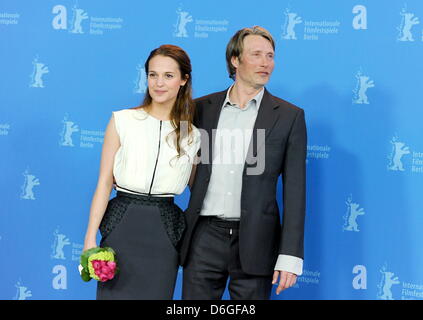 Swedish actress Alicia Vikander and Danish actor Mads Mikkelsen pose at the photocall for the movie 'A Royal Affair' ('En Kongelig Affære') during the 62nd Berlin International Film Festival, in Berlin, Germany, 16 February 2012. The movie is presented in the competition at the 62nd Berlinale running from 09 to 19 February. Photo: Britta Pedersen Stock Photo