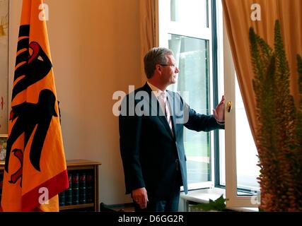 FILE - A file photo dated 06 August 2010 shows Geran President Christian Wulff standing at the window of his office at Bellevue Palace in Berlin, Germany.  The Hanover public prosecutor has late 16 February 2012 requested the immunity of President Christian Wulff to be lifted. The prosecutor says after investigating new documents and the analysis of media reports, there is now an i Stock Photo