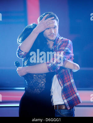 Winner Roman Lob from Neustadt/Wied hugs his defeated opponent Ornella de Santis from Offenburg during the finale of the qualifying show 'Unser Star für Baku' ('Unser Star for Baku') in Cologne, Germany, 16 February 2012. The talent show is meant to determine the German candidate for the 2012 Eurovision Song Contest in Azerbaijan. Photo: Henning Kaiser Stock Photo