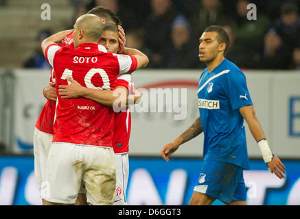 Mainz's Mohamed Zidan celebrates his 1-1 goal with team-mate Elkin Soto as Hoffenheim's Daniel Williams passes them by in the background during the Bundesliga match TSG 1899 Hoffenheim versus 1. FSV Mainz 05 at Rhein-Neckar-Arena in Sinsheim, Germany, 17 February 2012. Photo: Uwe Anspach Stock Photo