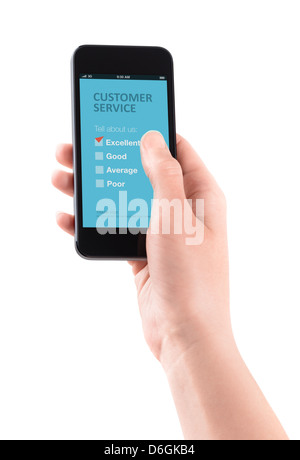 Female hand holding modern smartphone with customer service survey form on a screen. Stock Photo