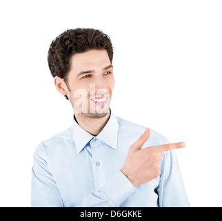 Close-up portrait of a successful handsome businessman, smiling and pointing on the copy space. Isolated on white background Stock Photo