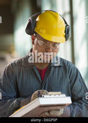 Engineer making notes on site Stock Photo