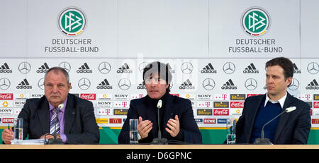 Head coach of the German national soccer team Joachim Loew (C), team manager Oliver Bierhoff (R) and press officer of the German football association Harald Stenger are pictured during a media workshop of the German Football Association (DFB) in Berlin, Germany, 22 February 2012. The team for the international match against France is to be announced and an update on the preparation Stock Photo