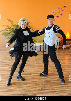 Danish singer Gitte Haenning dances with her dance partner Gennady Bondarenko during rehearsal for the RTL television show 'Let's Dance' at 'Mambita' dance school in Berlin, Germany, 22 February 2012. The dancing competition between stars will be broadcast from 14 March at 08:15 pm. Photo: Jens Kalaene Stock Photo