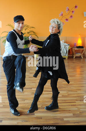 Danish singer Gitte Haenning dances with her dance partner Gennady Bondarenko during rehearsal for the RTL television show 'Let's Dance' at 'Mambita' dance school in Berlin, Germany, 22 February 2012. The dancing competition between stars will be broadcast from 14 March at 08:15 pm. Photo: Jens Kalaene Stock Photo