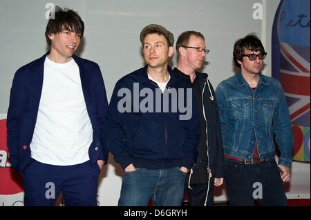 Musicians Alex James (l-r), Dave Rowntree, Damon Albarn and Graham Coxon of 'Blur' attend the Brit Awards 2012 at O2 Arena in Greenwich, in London, Great Britain, on 21 February 2012. Photo: Hubert Boesl Stock Photo