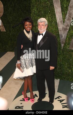 Director George Lucas and wife Mellody Hobson attend the 2012 Vanity Fair Oscar Party at Sunset Tower in Los Angeles, USA, am 26 Februar 2012. Photo: Hubert Boesl Stock Photo