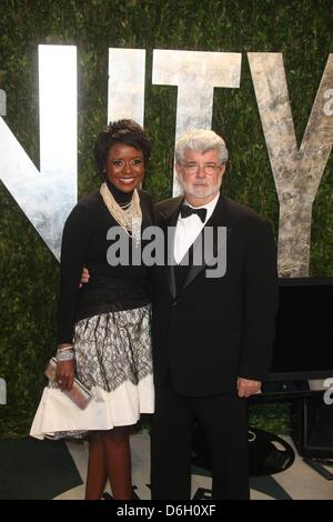 Director George Lucas and wife Mellody Hobson attend the 2012 Vanity Fair Oscar Party at Sunset Tower in Los Angeles, USA, am 26 Februar 2012. Photo: Hubert Boesl Stock Photo