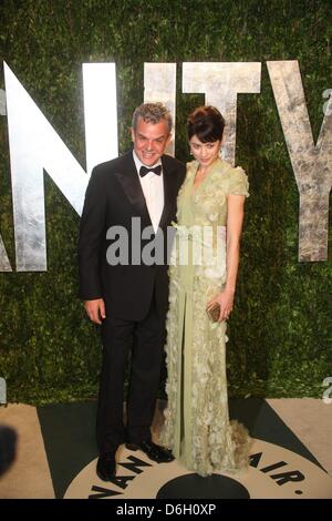 Actress Olga Kurylenko and director Danny Huston attend the 2012 Vanity Fair Oscar Party at Sunset Tower in Los Angeles, USA, am 26 Februar 2012. Photo: Hubert Boesl Stock Photo