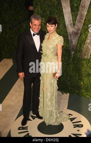 Ukrainian actress Olga Kurylenko and US director Danny Huston attend the 2012 Vanity Fair Oscar Party at Sunset Tower in Los Angeles, USA, am 26 Februar 2012. Photo: Hubert Boesl Stock Photo