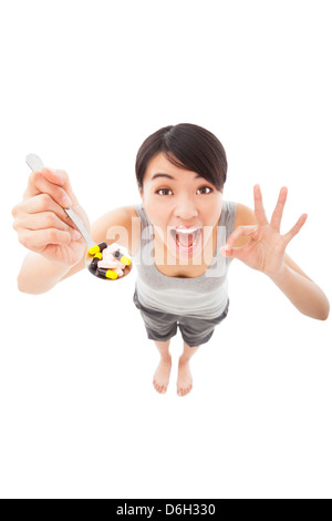 young woman holding pills with ok gesture Stock Photo