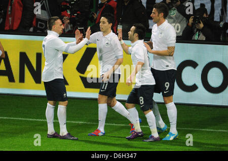 France's Olivier Giroud (R) celebrates with  Franck Ribery (l-r), Samir Nasr and Mathieu Valbuena after scoring 1-0 during the international friendly soccer match Germany vs France at the Weser stadium in Bremen, Germany, 29 February 2012. Photo: Julian Stratenschulte dpa/lni  +++(c) dpa - Bildfunk+++ Stock Photo