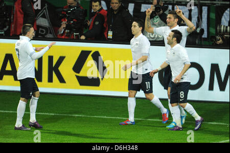 France's Olivier Giroud (2R) celebrates with  Franck Ribery (L-R), Samir Nasr and Mathieu Valbuena after scoring 1-0 during the international friendly soccer match Germany vs France at the Weser stadium in Bremen, Germany, 29 February 2012. Photo: Julian Stratenschulte dpa/lni  +++(c) dpa - Bildfunk+++ Stock Photo