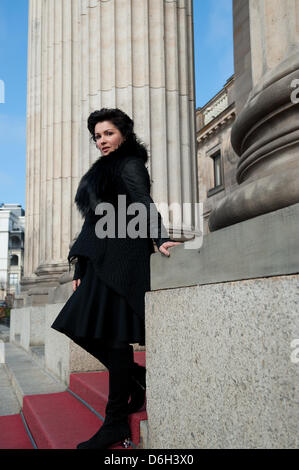 Russian soprano Anna Netrebko poses in front of the kurhaus after a press conference in Wiesbaden, Germany, 01 March 2012. The world star of classical music will perform an open air concert with her partner E. Schrott at the Bowling Green in Wiesbaden on 09 June 2012. Photo: ARNE DEDERT Stock Photo