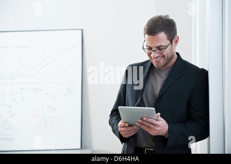 Businessman using tablet computer Stock Photo